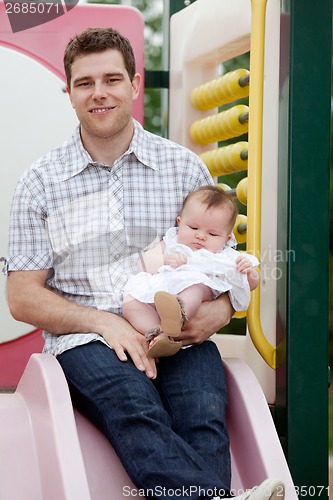 Image of Young Father with Little Baby Girl