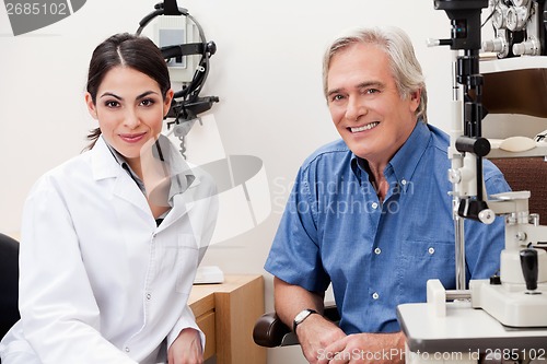 Image of Smiling Optometrist With Her Patient