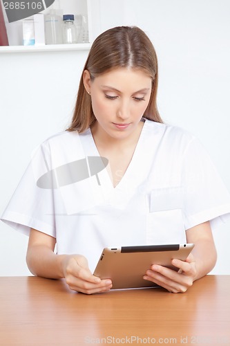 Image of Medical Professional Using Digital Tablet