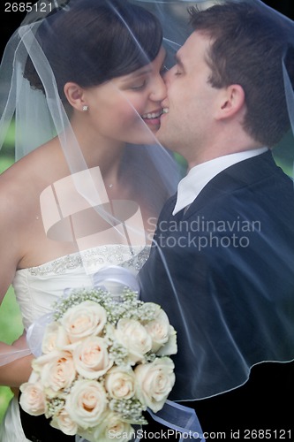 Image of Newlywed Couple Kissing