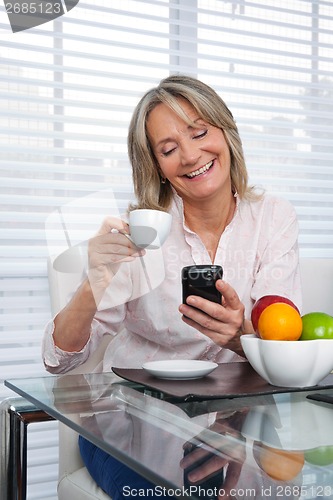 Image of Mature Woman Using Phone