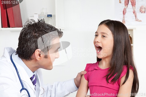 Image of Doctor Examining a Child Mouth