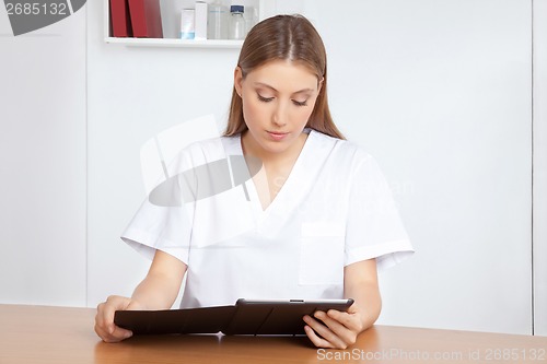 Image of Medical Professional Using Digital Tablet