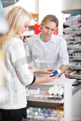 Image of Pharmacist Helping Customer