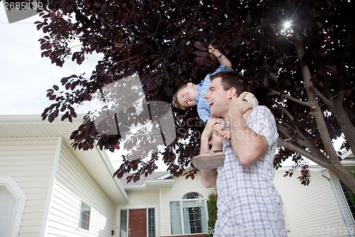 Image of Portrait Of Boy Sitting On Father's Shoulder