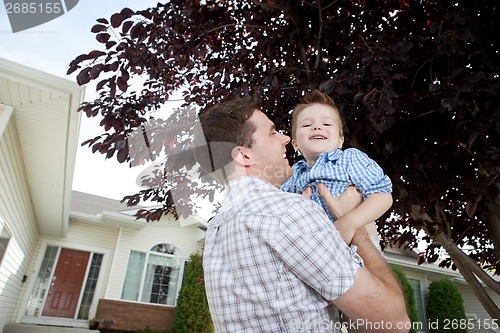 Image of Father and Son Playing Outdoors