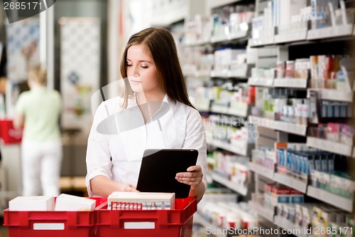 Image of Female Pharmacist with Digital Tablet