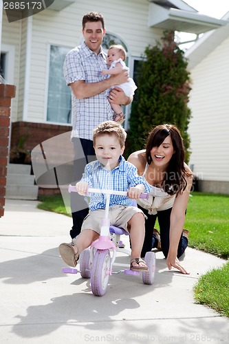 Image of Cute Boy Riding Tricycle