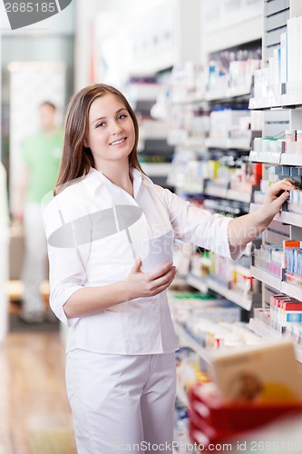 Image of Female Standing in Pharmacy