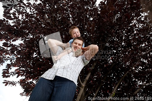 Image of Portrait Of Boy Sitting On Father's Shoulders
