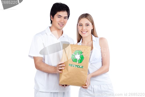 Image of Young Couple  Holding Paper Bag