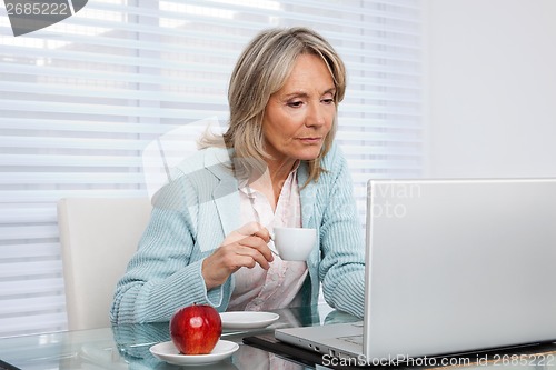 Image of Woman Working on Laptop