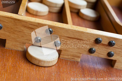 Image of Typical dutch wooden boardgame - Sjoelen