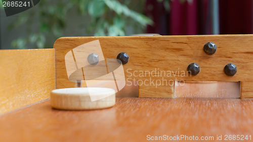 Image of Typical dutch wooden boardgame - Sjoelen