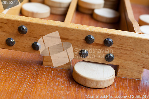 Image of Typical dutch wooden boardgame - Sjoelen