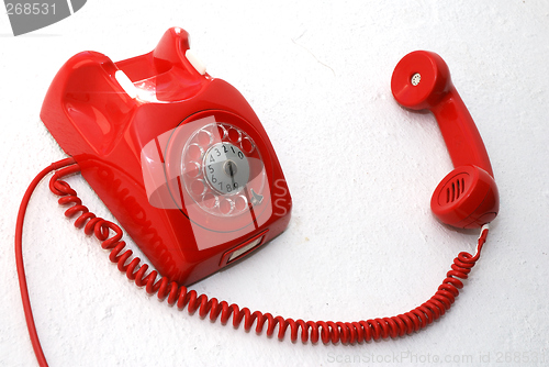 Image of Red phone off the hook.
