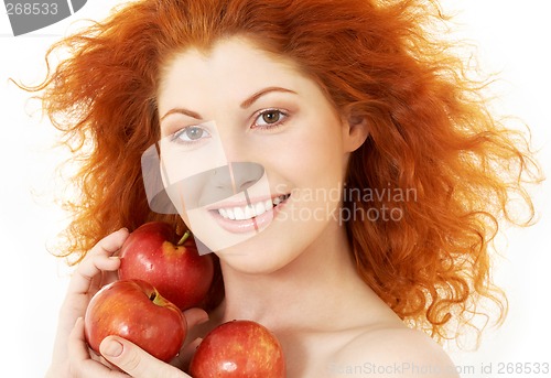 Image of happy redhead with red apples