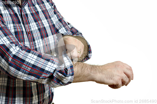 Image of Man rolls up sleeves