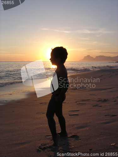 Image of Kid on the beach in silhouette