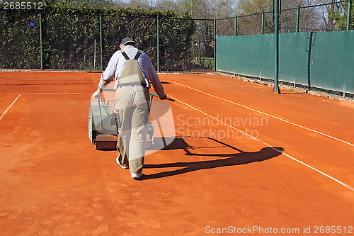 Image of Rolling a tennis court
