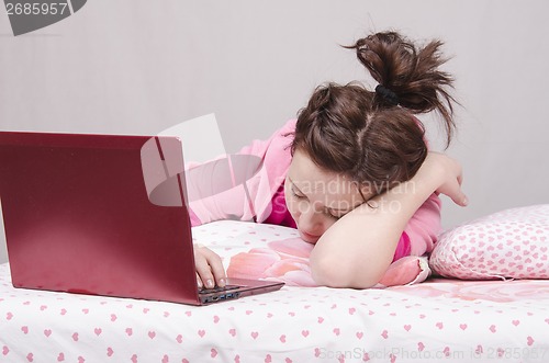 Image of Girl in bed asleep for a laptop