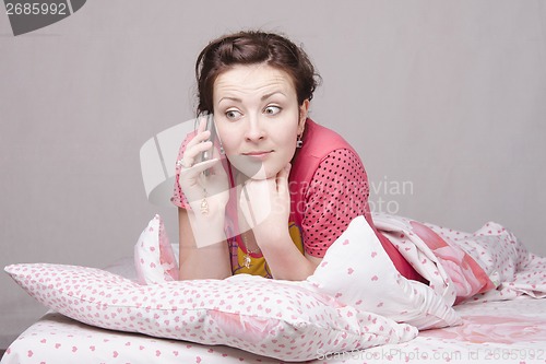 Image of girl in shock from talking phone