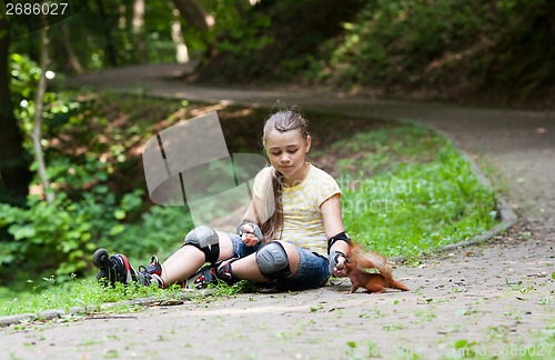 Image of Rollergirl and squirrel