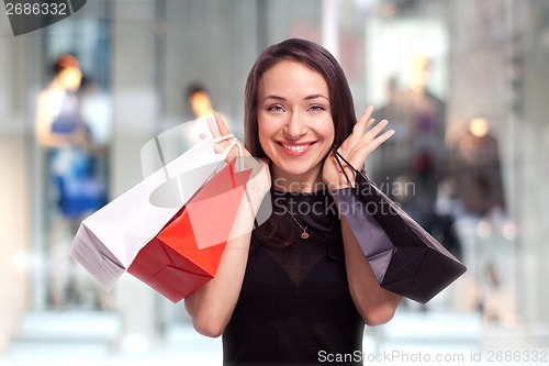 Image of Shopping Girl with showcase background