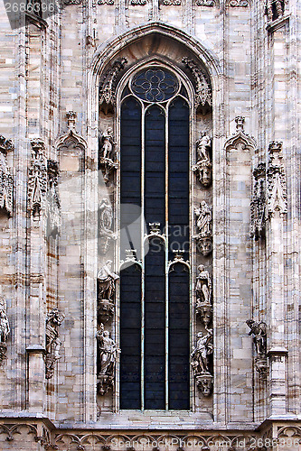 Image of italy church mwindow  the front of  duomo  in milan and column