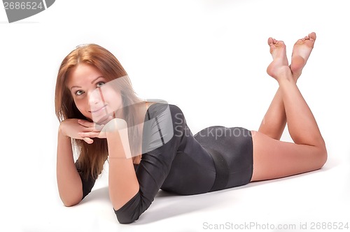 Image of Attractive woman in gym suit