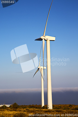 Image of spain house africa wind turbines and the sky  