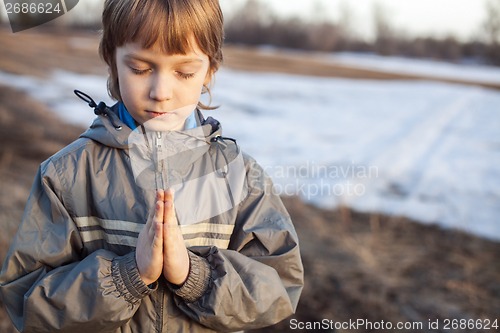 Image of boy at prayer
