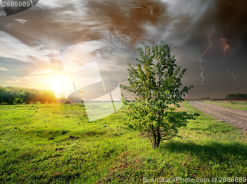 Image of Lightning and road in field