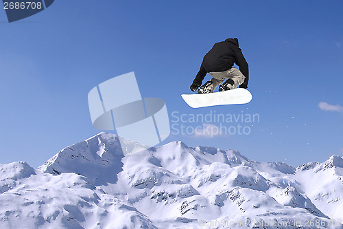 Image of Snowboarder jumping