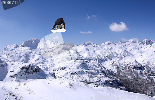 Image of Snowboarder jumping