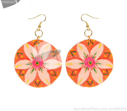 Image of earrings made of felt in the form of a flower 
