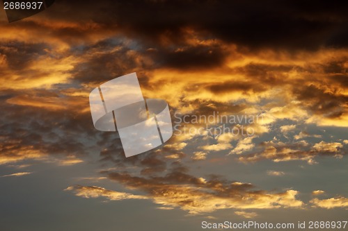 Image of Fiery sunset sky on summer sea