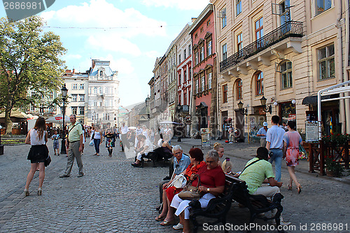 Image of street in Lvov with people having a rest