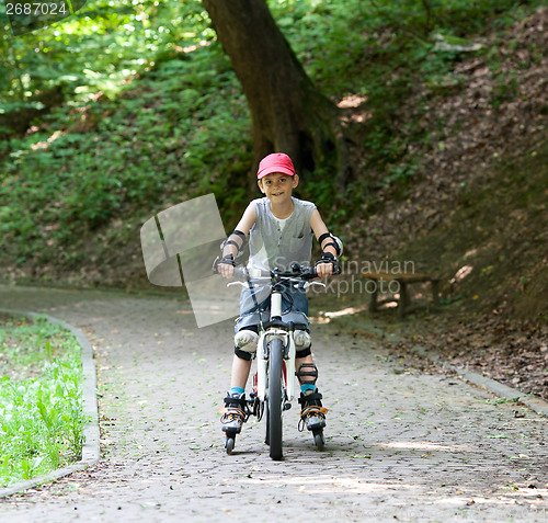 Image of Skates and bike boy