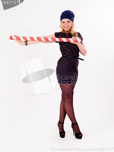 Image of beautiful fashionable woman with stick