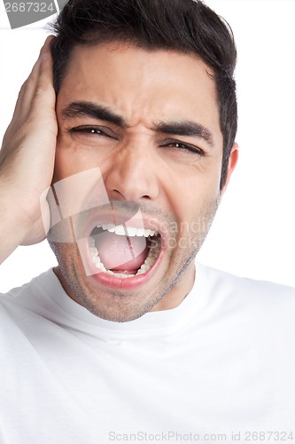 Image of Young Asian Man Covering Ears