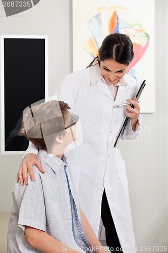 Image of Boy With Vision Problems Consulting To Optometrist