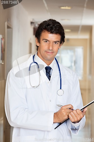 Image of Doctor Writing Report