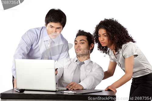 Image of Businessman and Businesswoman Using Laptop