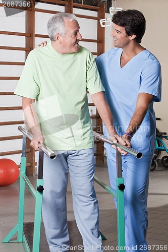 Image of Senior Man having ambulatory therapy