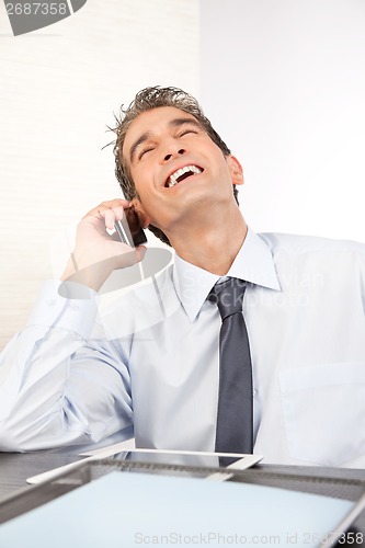 Image of Businessman Talking on Cell Phone