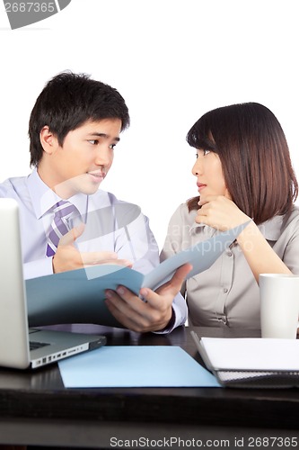 Image of Businessman And Businesswoman At Work