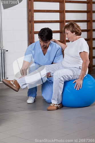 Image of Physical Therapist helping a Patient