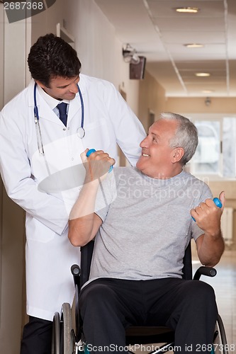 Image of Doctor with Patient on Wheel Chair