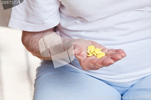 Image of Sick Woman taking her Pills